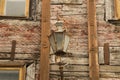 Windows of the old wooden house. wooden wall with vintage lamp