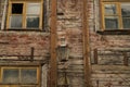 Windows of the old wooden house. wooden wall with windows and vintage lamp