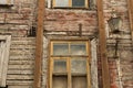 Windows of the old wooden house. wooden wall with windows and vintage lamp