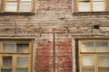 Windows of the old wooden house. wooden wall with windows