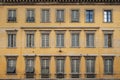 Windows on old yellow vintage building