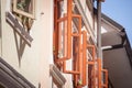 Selective blur on open windows with a wooden frame on the facade of an old & renovated medieval building of Skofja Loka, Slovenia