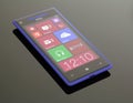 Windows Phone 8 on reflective, glass table. Royalty Free Stock Photo