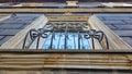 Windows and Pilaster of an Old Black Building