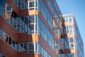 Windows of a red office building Royalty Free Stock Photo