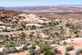 The Windows road winding through desert in Arches National Park, view from Garden of Eden viewpoint