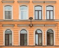 Windows in a row and streetlight on facade apartment building Royalty Free Stock Photo