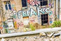 Windows on a ruined building with graffiti