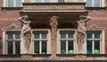 windows and sculpture balcony, Riga, Latvia Royalty Free Stock Photo