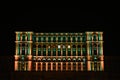 The windows at the top of the Parliament Palace in Bucharest lit in various colors. People`s House lit in divers colors