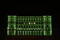 The windows at the top of the Parliament Palace in Bucharest lit in various colors. People`s House lit in divers colors