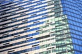 Windows of under construction high-rise building, view of modern glass and concrete exterior of high rise building Royalty Free Stock Photo