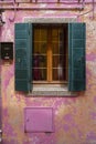 Windows of Venice, Murano and Burano. Picturesque windows with shutters on the famous island Burano. Decorated window on colorful Royalty Free Stock Photo