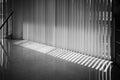 Windows with vertical blinds, Detail of the interior texture with lights and shadows on the floor Royalty Free Stock Photo