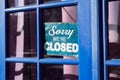 Windows vintage shop sign saying sorry we are closed