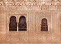 Windows and walls with patternes inside medieval architecture complex, the 4th century palace Alhambra Royalty Free Stock Photo