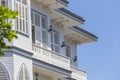 Windows with white wooden shutters on wall building, Turkey