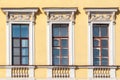 Windows on the yellow wall Royalty Free Stock Photo