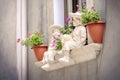 Windowsill statues children background flowerpots balcony window sill