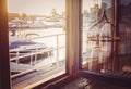 Windowview on the pier and yachts.