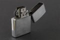 Windproof petrol lighter in metal style, on a dark background Royalty Free Stock Photo