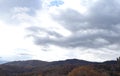 Winds of Change: Autumn Rainstorm Rising Over Mountain Ridge Royalty Free Stock Photo