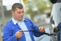 Windscreen technician replacing wipers