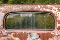 Windshield of rusted truck