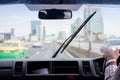 Windshield wipers from inside of car, rainy season Royalty Free Stock Photo