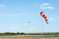 Windsock against cloudy sky. Royalty Free Stock Photo