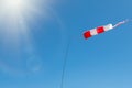 Windsock on a background of blue sky on a sunny day Royalty Free Stock Photo