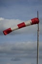 Windsock blown by the wind on the field Royalty Free Stock Photo