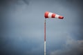 Windsock blown by the wind with overcast sky Royalty Free Stock Photo