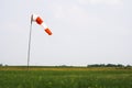 Windsock on grass runway Royalty Free Stock Photo