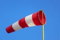 Windsock indicator of wind on runway airport.  Wind cone indicating wind direction and force. Horizontally flying windsock Royalty Free Stock Photo