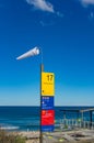 Windsock and information board. High wind on the beach