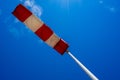windsock in operation with strong blue sky background. Royalty Free Stock Photo