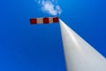 windsock in operation with strong blue sky background with sun Royalty Free Stock Photo