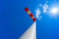 windsock in operation with strong blue sky background with sun Royalty Free Stock Photo