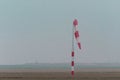 Windsock resting on agricultural field in winter time . Royalty Free Stock Photo