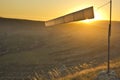 Windsock at sunset in mountains against sun Royalty Free Stock Photo
