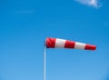 The windsock in wind against blue sky Royalty Free Stock Photo