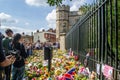 WINDSOR, ENGLAND- 11 September 2022: Mourners at Windsor Castle with flowers following`s death