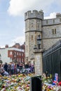 WINDSOR, ENGLAND- 11 September 2022: Mourners at Windsor Castle with flowers following`s death
