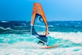 Windsurf riding the waves during a summer day Royalty Free Stock Photo