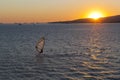 Windsurfer against the setting sun in Gelendzhik Bay Royalty Free Stock Photo