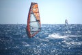 Windsurfer at the Atlantic ocean sparkling in the sun, in back light Royalty Free Stock Photo