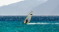 Windsurfer on the background of high mountains rides on the waves of the Red Sea in Egypt Dahab South Sinai Royalty Free Stock Photo