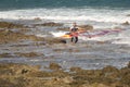 Windsurfer carrying his windsurf board. Royalty Free Stock Photo