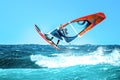 Windsurfer jumping in the waves in the Atlantic Ocean Royalty Free Stock Photo